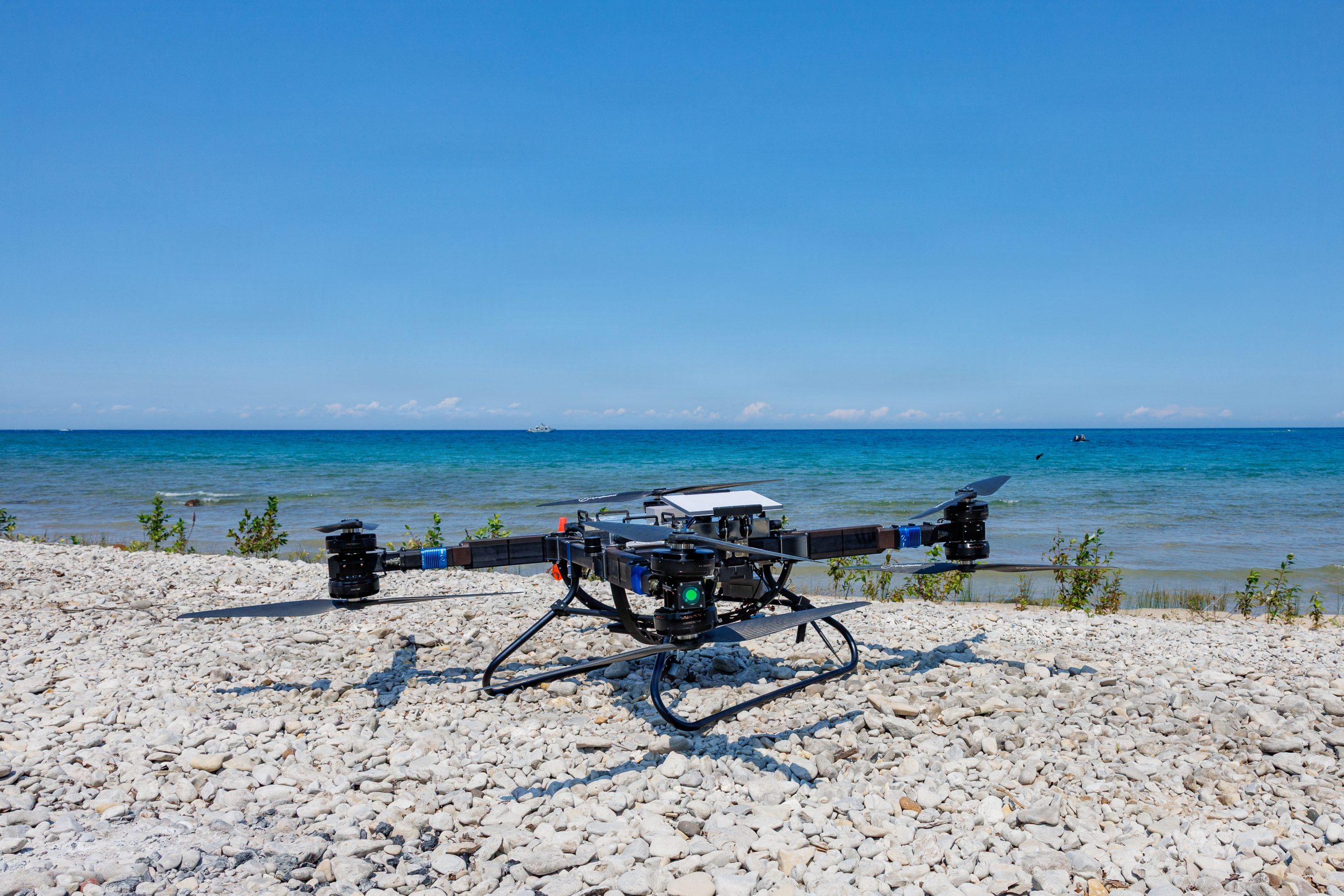 An unmanned aircraft system is staged on the beach