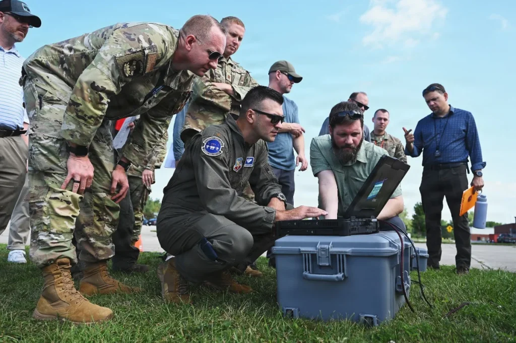 Military personnel and specialists evaluate the C2E portable control system prototype