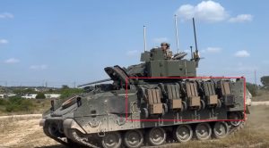 M2A4 Bradley IFV with five FireAnt UGVs