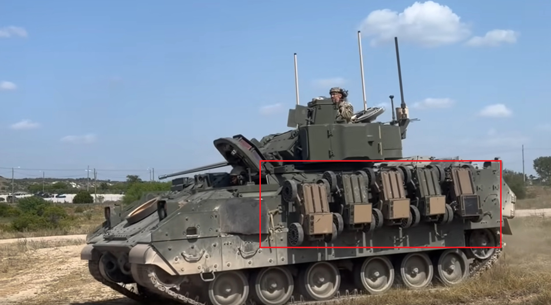 M2A4 Bradley IFV with five FireAnt UGVs