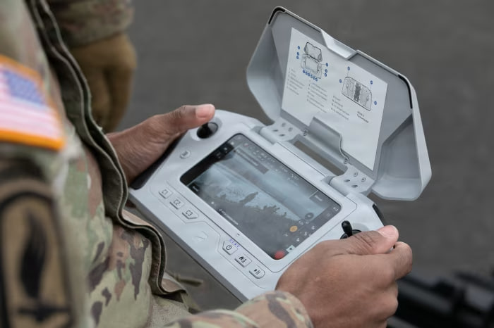 A U.S. Army servicemember using a small unmanned aircrafts system, or sUAS, controller
