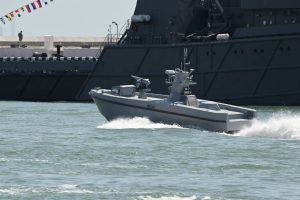 An armed unmanned surface vessel, likely the SALVO, during testing.