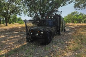 Modernized ELVO Mercedes G-Class off-road vehicle featuring anti-drone protection and camouflage.