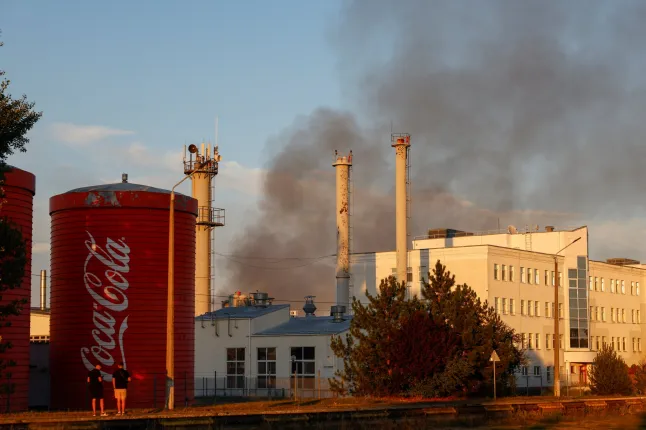 Smoke rises from a Coca-Cola plant in Brovary, a city just outside Kyiv, following a Russian drone attack